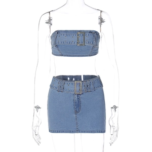 Detail of light blue denim tube top with metallic buckle belt and matching mini skirt