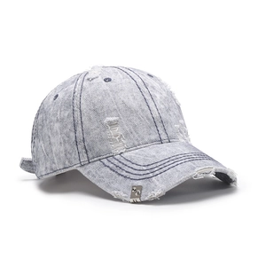 Distressed washed denim baseball cap in light blue with vintage rip details and metal buckle