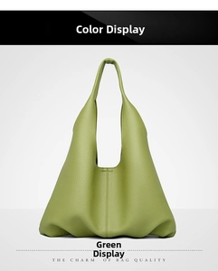 Detailed view of the soft lychee grain green leather texture on the large tote bag