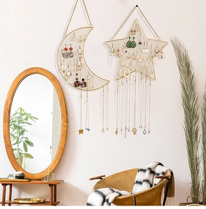 Modern gold metal wall-mounted grid organizer for earrings with moon and star shapes