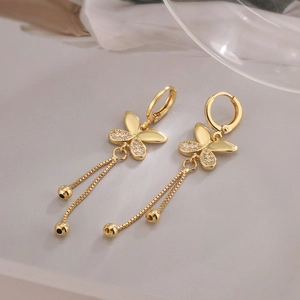 Macro shot of 18K gold plated butterfly tassel earrings with sparkling zircon micro-inlay
