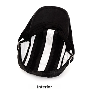 Detail view of cotton beret inner lining with black and white vertical stripe pattern