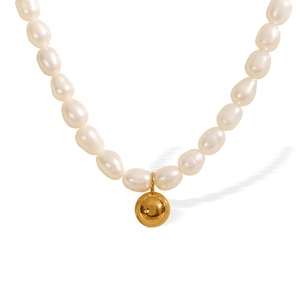 Lustrous baroque freshwater pearl necklace with a polished gold spherical pendant charm