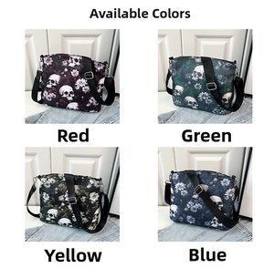 Detail view of gothic floral skull patterns and hardware on various shoulder bags