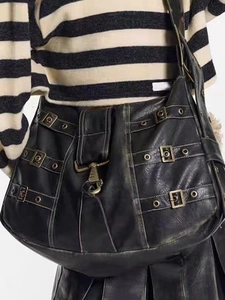Retro black leather tote bag with punk metal buckle straps and eyelet details