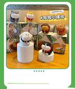 Detailed view of resin puppy figurines with realistic fur texture and gift packaging