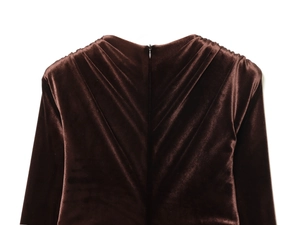 Detail of invisible back zipper and gathered velvet fabric on dark brown midi dress