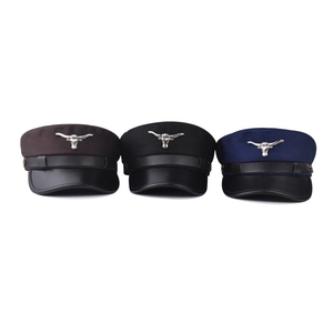 Flat top cadet caps in brown black and navy blue with bull head metal emblem and leather brim