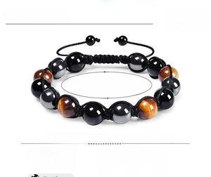 Detailed view of 10mm tiger eye hematite and onyx beads with adjustable braided cord