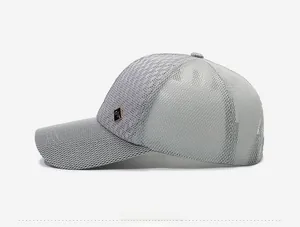 Side view of gray mesh baseball cap showing breathable texture and metallic logo