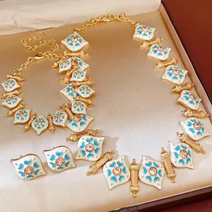 Vintage gold jewelry set with rhinestone heart enamel pendant necklace, bracelet and earrings