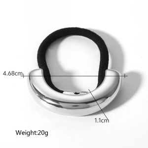 Detail view of black elastic hair tie with silver U-shaped metal cuff and dimensions