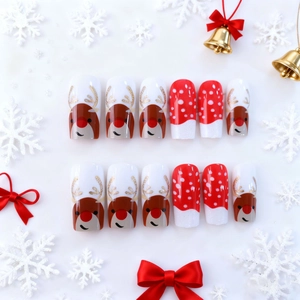 Christmas press-on nails featuring cute reindeer motifs and glitter red snowflake designs