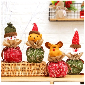 Christmas drawstring gift bags with cartoon Santa, snowman and deer designs in burlap