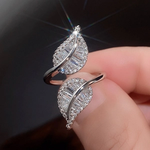 Detail shot of a silver leaf open ring featuring high-quality sparkling zircon stones
