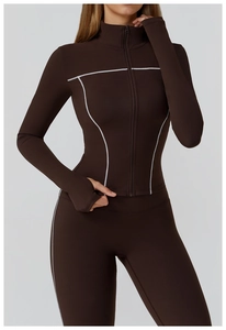 Detail of slim fit yoga jacket with contrast stitching and thumbhole cuffs on sleeves
