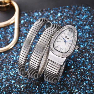 Macro view of Cussi silver snake-shaped coil watch with white dial and blue hands
