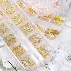 Mixed metal nail art charms set including hollow shapes and rivets in a 12-grid storage box