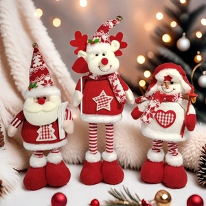 Christmas plush dolls featuring Santa, Reindeer and Snowman on cozy white carpet