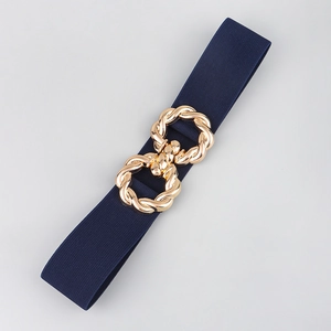 Detail of navy blue elastic waist belt featuring a gold twisted interlocking metal buckle
