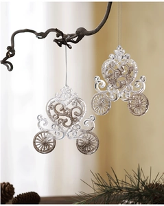 Macro view of transparent acrylic pumpkin carriage ornaments with gold glitter for Xmas