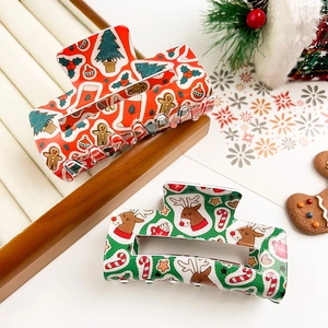 Lot de pinces à cheveux de Noël avec motifs renne et pain d'épice sur fond festif