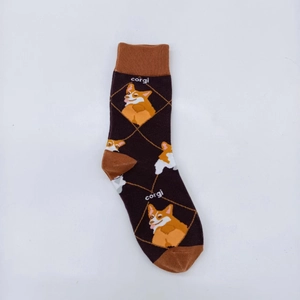 Detail of ribbed cuff and cute cartoon Corgi jacquard pattern on brown mid-calf socks