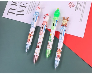 Detail of Christmas multi-color ballpoint pens with Santa and reindeer silicone toppers