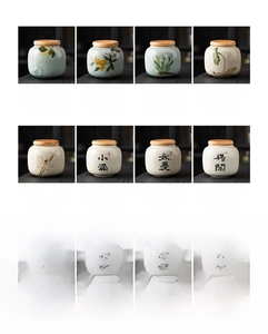 Detail view of 8 mini ceramic tea jars with bamboo lids featuring calligraphy and floral art