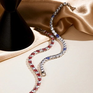 Detailed view of evil eye tennis bracelets with blue, red and white zircon accents