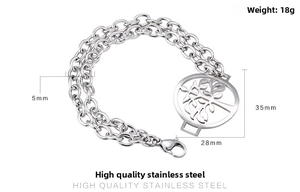 Detailed view of stainless steel double-layer chain bracelet with tree of life pendant