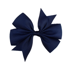 Detail of navy blue grosgrain ribbon texture and stylish V-shape bow hair clip for girls