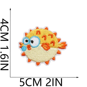 Cute pufferfish embroidered patch in yellow and blue, sized 5cm x 4cm for clothing decor
