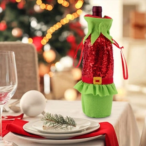 Detailed view of a sequined Christmas elf bottle cover on a festive holiday dining table