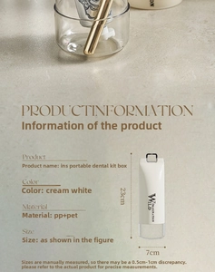 Macro detail of cream-colored portable toothbrush case with gold handle on stone surface
