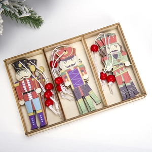 Set of nine colorful nutcracker wooden ornaments in a storage box for Christmas trees