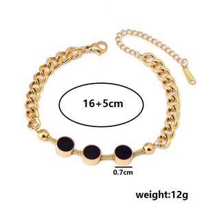 Titanium steel chain bracelet with three black circular charms in gold finish
