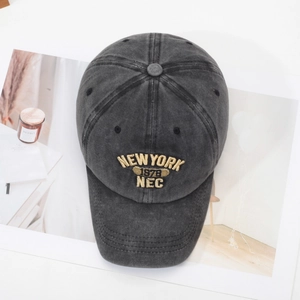 Retro washed cotton baseball cap with New York embroidery in a 45-degree angled view