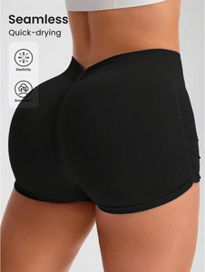 Close-up of seamless black yoga shorts featuring V-waist and ribbed lifting texture