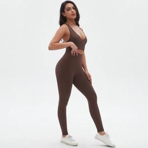 Detail of seamless yoga set with V-neck cross-back bra and high-waist leggings in dark brown