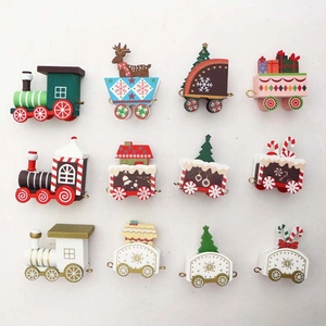 Three sets of festive wooden Christmas train decorations in red, white and gold styles