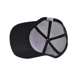 Detail view of black trucker hat mesh structure and inner white laundry label