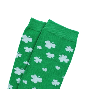 Detail of green ribbed sock cuff featuring white shamrock patterns for St. Patrick's Day