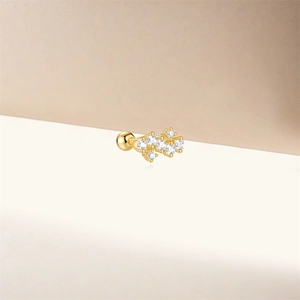 Close-up of S925 silver gold-plated stud earring with clear cubic zirconia stones