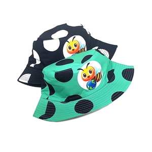 Kids bee print bucket hats with polka dots in green and black for outdoor sun protection