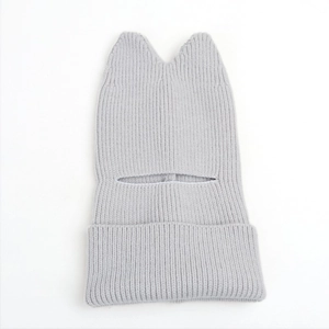 Detailed knit texture of light gray winter balaclava with cute cat ears design