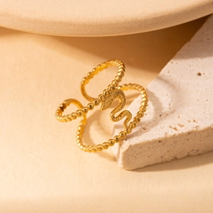Elegant gold snake-shaped beaded ring with adjustable open band on stone base
