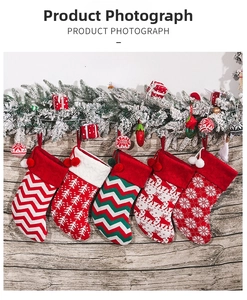 Set of five knitted Christmas stockings with reindeer and snowflake patterns