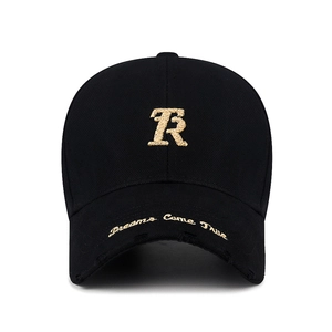 Distressed black cotton baseball cap with gold R embroidery and frayed brim detail