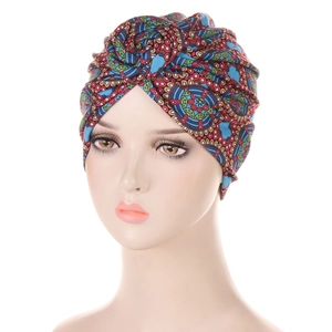Detail of vibrant African tribal print turban with intricate ethnic patterns and colors